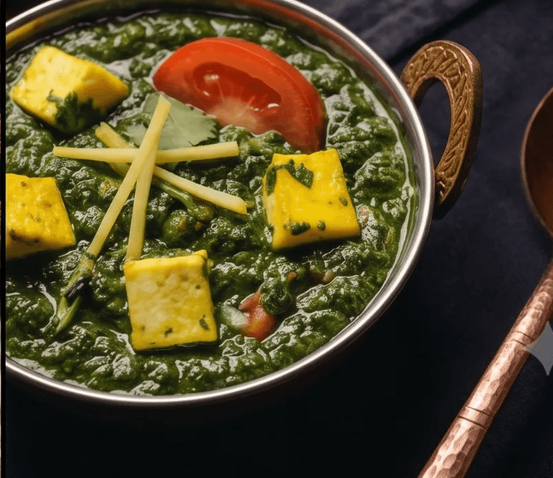 Concept: saag paneer close up, dark studio lighting