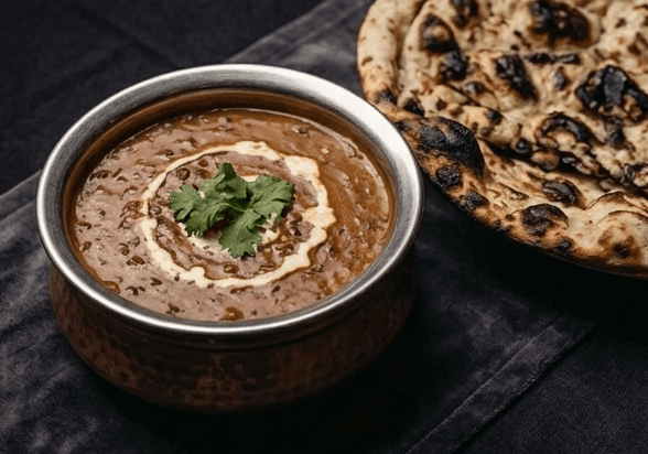 Slow-cooked black dal makhani with fresh naan